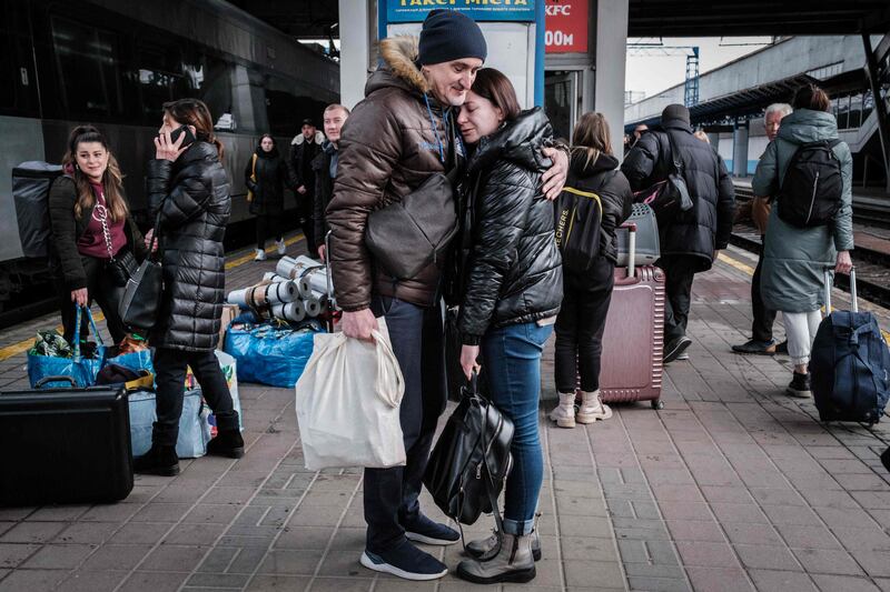 Ihor welcomes Lyudmila, who has returned from neighboring Poland, at Kyev-Pasazhyrsky train station. AFP