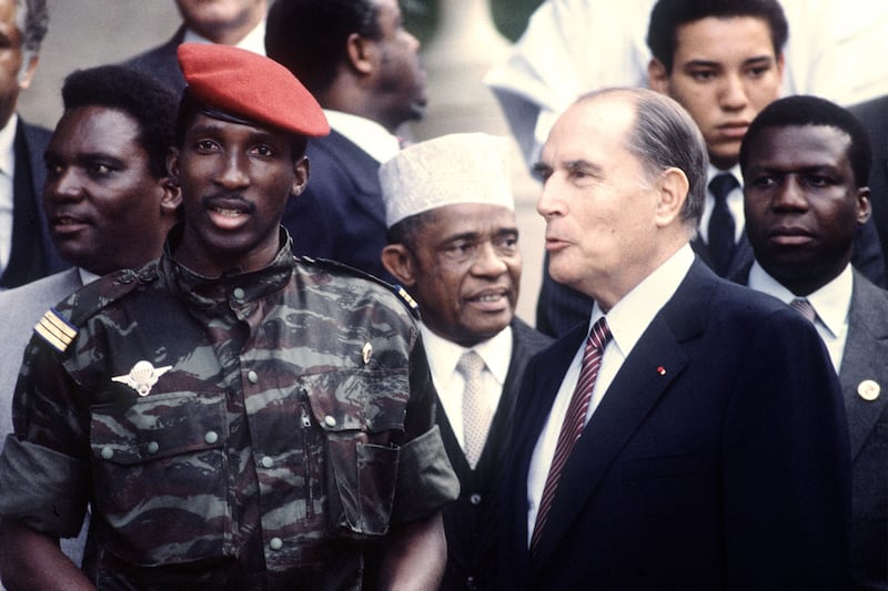 Sankara in paratrooper uniform with then-French president Francois Mitterrand in Vittel, France, 1983. AFP