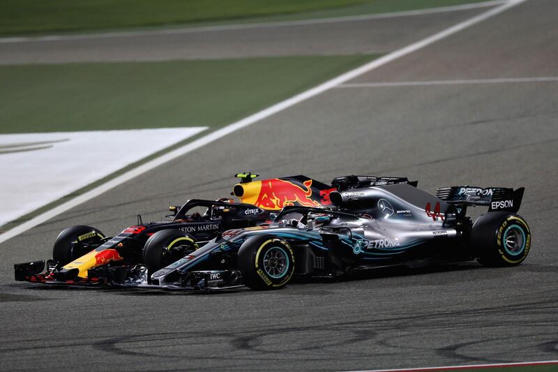 BAHRAIN, BAHRAIN - APRIL 08:  Max Verstappen of the Netherlands driving the (33) Aston Martin Red Bull Racing RB14 TAG Heuer battles with Lewis Hamilton of Great Britain driving the (44) Mercedes AMG Petronas F1 Team Mercedes WO9 on track during the Bahrain Formula One Grand Prix at Bahrain International Circuit on April 8, 2018 in Bahrain, Bahrain.  (Photo by Lars Baron/Getty Images)