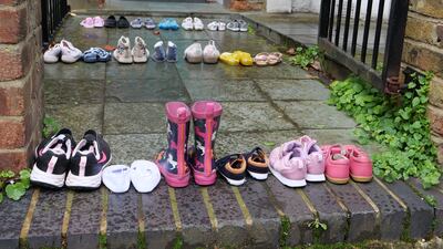 Rows of children's shoes were used in the protest outside the home of Keir and Victoria Starmer. Youth Demand 