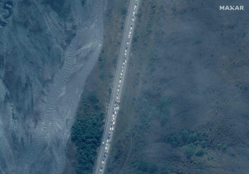 A satellite picture shows lorries and cars in a traffic jam near the Russian border with Georgia. Thousands of men are trying to flee Russia after President Vladimir Putin's call for the mobilisation of 300,000 troops for the war in Ukraine. AFP