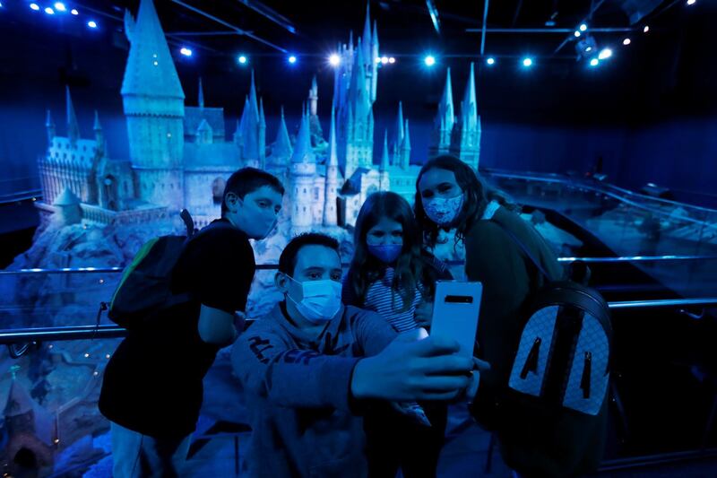 Visitors take a selfie at the Warner Bros. Studio Tour London during the reopening in Watford, Britain. Reuters
