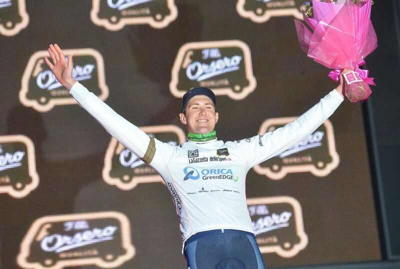 Australian rider Luke Durbridge of the Orica GreenEdge team wears the White jersey as he celebrates on the podium after his team won the first stage of the 2014 Giro d'Italia in Belfast on Friday. Luca Zennaro / EPA