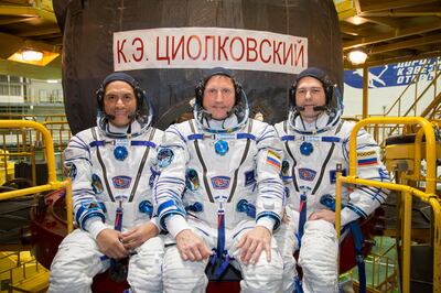 From left, Nasa astronaut Frank Rubio, Roscosmos cosmonaut Sergey Prokopyev and cosmonaut Dmitri Petelin in front of their Soyuz MS-22 spacecraft. Photo: Nasa 