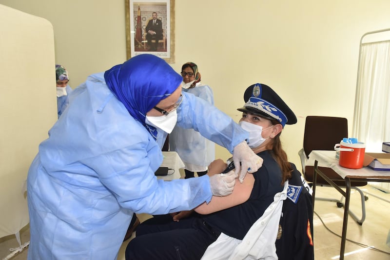 A nurse vaccinates a Police officer against the Covid-19 coronavirus in Sale. EPA