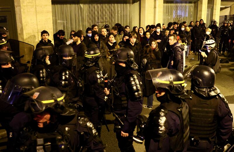 Protesters are surrounded by riot police in Paris. Reuters