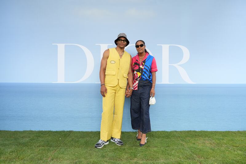 US basketball players Russell and Nina Westbrook attend the Dior Homme photocall. Getty Images For Christian Dior