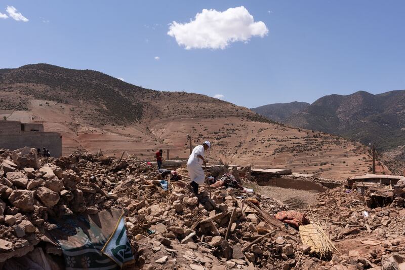Villagers survey the rubble of destroyed buildings after the earthquake near Amizmiz, in El Haouz district. Bloomberg