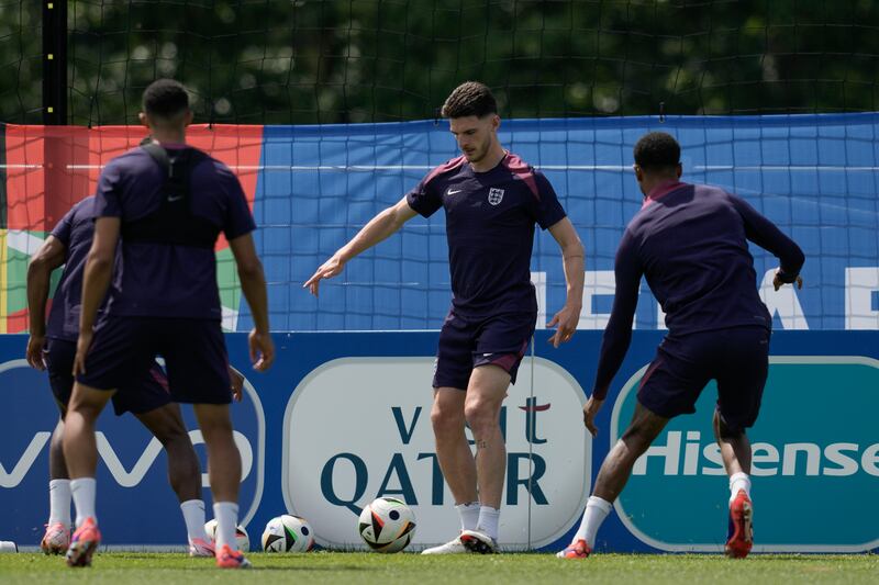England midfielder Declan Rice, centre, training with teammates in Blankenhain. AP