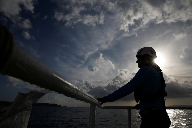 A crew member stands on the upper deck of the migrant search and rescue ship Sea-Watch 3, operated by German NGO Sea-Watch, as it sets course for the search and rescue zone in the central Mediterranean after a technical stopover in Bonifacio, on the island of Corsica, France November 22, 2018. REUTERS/Darrin Zammit Lupi