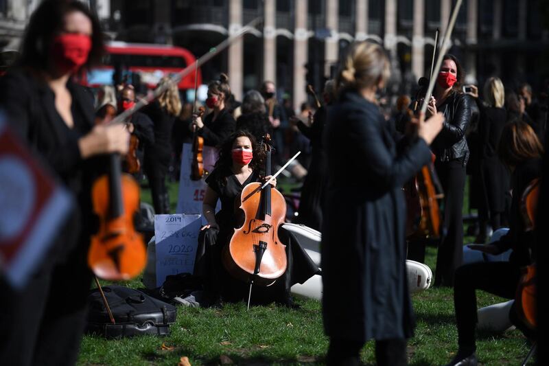 Freelance musicians from 'Let Music Live' pressure group perform in Parliament Square in London. EPA
