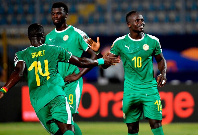 Senegal forward Sadio Mane, right, celebrates after scoring the second of his two second-half goals against Kenya. AFP