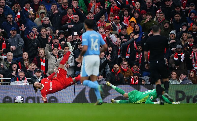 Liverpool's Darwin Nunez brought down in the box by Manchester City goalkeeper Ederson, resulting in a penalty from which Mac Allister scored the home side's equaliser. PA 