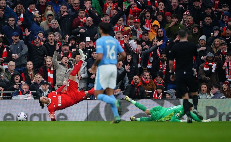 Liverpool's Darwin Nunez brought down in the box by Manchester City goalkeeper Ederson, resulting in a penalty from which Mac Allister scored the home side's equaliser. PA 