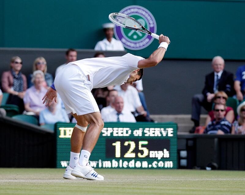 Novak Djokovic smashes his racquet in frustration during his match against Marcos Baghdatis of Cyprus in their third round match at Wimbledon in 2011. EPA