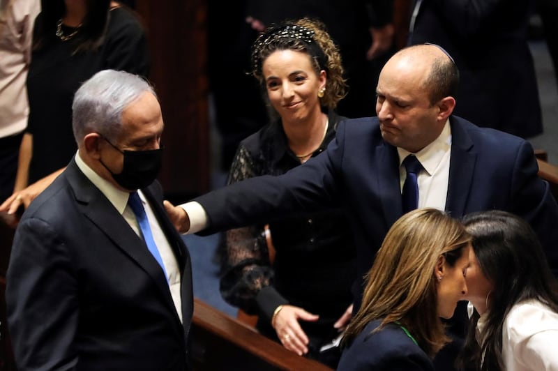 Former prime minister and now head of the opposition Benjamin Netanyahu and Mr Bennett following the vote in the Knesset, Israel's parliament, on June 13. Reuters