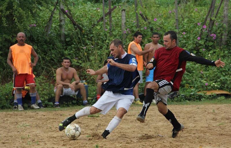 Pelada can refer to a street match where everyone plays barefoot with ‘naked’ feet, or a match on a grassless ‘naked’ field, or a match with a ball so worn that it is ‘naked’. Nuno Guimaraes / Reuters