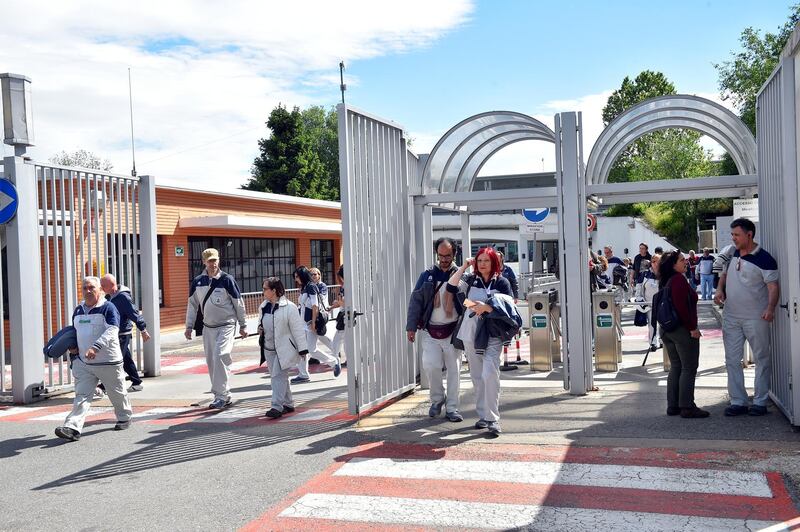 Fiat Chrysler Automobiles (FCA) workers exit the Mirafiori plant in Turin, Italy May 13, 2019. Picture taken May 13, 2019. REUTERS/Massimo Pinca