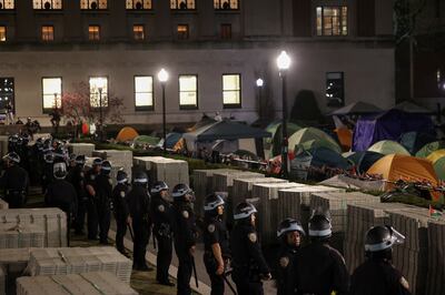 Police stand guard near an encampment of protesters supporting Palestinians on the grounds of Columbia University. Reuters