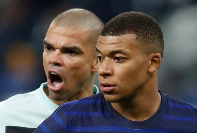 France's Kylian Mbappe and Portugal's Pepe. Reuters