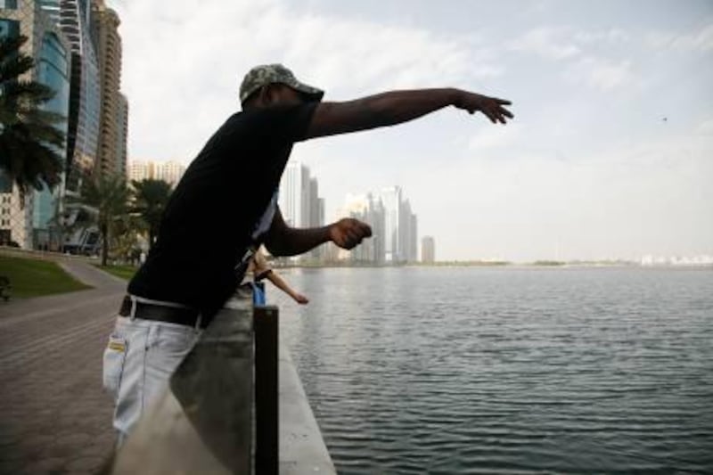 Sharjah, UAE, January 9, 2013:

Tee Al Qasr Corniche has now become a fishing free zone. Violators of the law are subject to fines from the municipality.

Seen here are unitenfied men breaking the ban. 

Lee Hoagland/The National