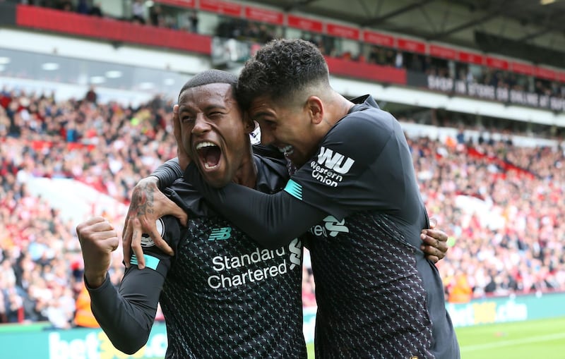 Liverpool's Georginio Wijnaldum celebrates scoring his side's first goal of the game with team-mate Roberto Firmino during the Premier League match at Bramall Lane, Sheffield. PA Photo. Picture date: Saturday September 28, 2019. See PA story SOCCER Sheff Utd. Photo credit should read: Richard Sellers/PA Wire. RESTRICTIONS: EDITORIAL USE ONLY No use with unauthorised audio, video, data, fixture lists, club/league logos or "live" services. Online in-match use limited to 120 images, no video emulation. No use in betting, games or single club/league/player publications.