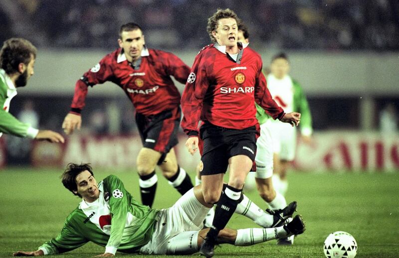4 Dec 1996:  Ole Gunnar Solskjaer (right) of Manchester United is tackled by Thomas Zingler of Rapid Vienna during a Champions League match in Vienna, Austria. Manchester United won the match 2-0. \ Mandatory Credit: Clive  Brunskill/Allsport