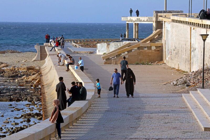 People walk along the waterfront promenade in Libya's eastern second city of Benghazi. AFP