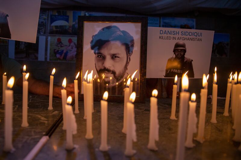 Journalists in New Delhi, India, light candles and pay tribute to Reuters photographer Danish Siddiqui, who was killed in Afghanistan covering clashes between the Taliban and Afghan security forces. AP