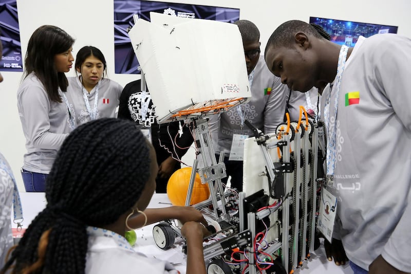 DUBAI , UNITED ARAB EMIRATES , October 26 – 2019 :-  Team member of Benin working on their robot at the First Global Challenge robotics competition held at Festival Arena in Dubai.  ( Pawan Singh / The National ) For News. Story by Patrick