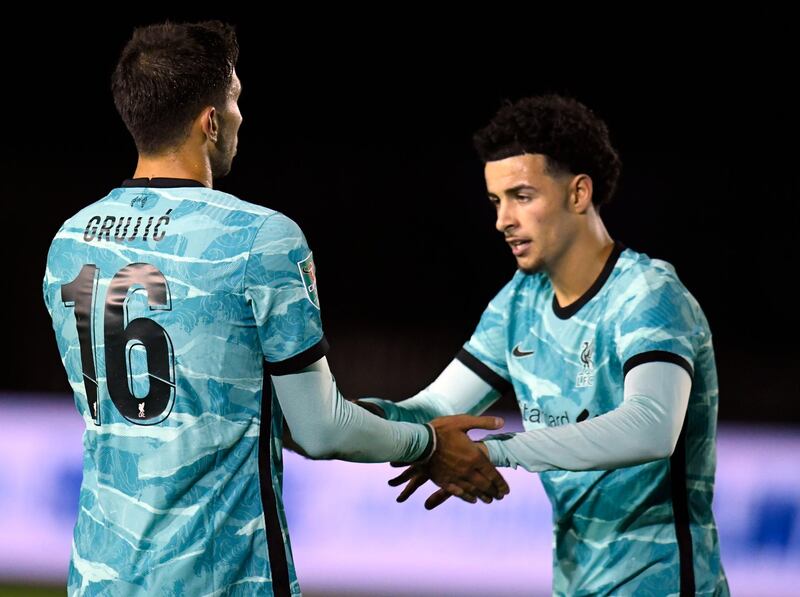 Liverpool's Marko Grujic with teammate Curtis Jones after scoring the team's sixth goal. EPA