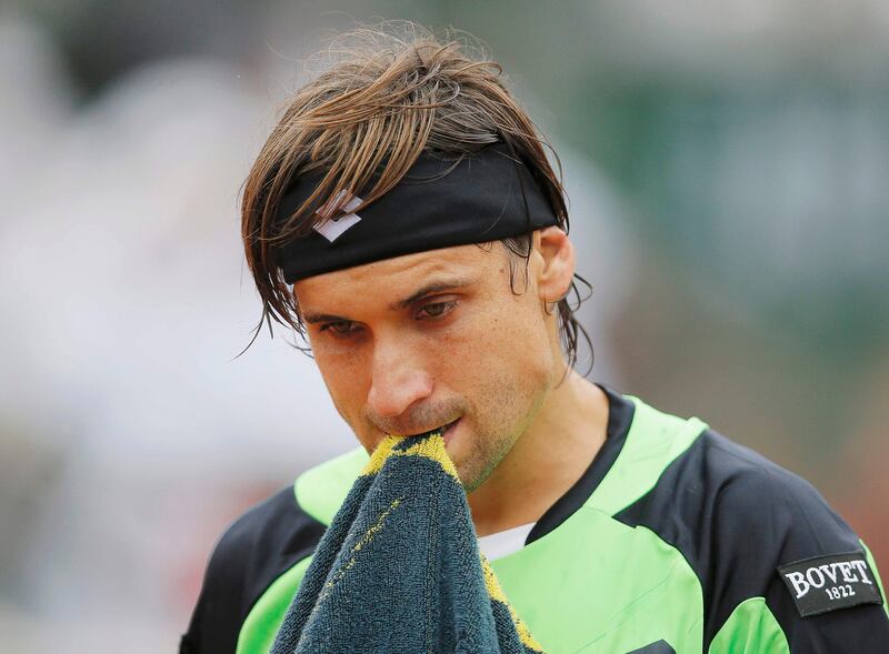 David Ferrer of Spain reacts during his men's singles final match against compatriot Rafael Nadal at the French Open tennis tournament at the Roland Garros stadium in Paris June 9, 2013. Ferrer lost the match to Nadal. REUTERS/Gonzalo Fuentes (FRANCE  - Tags: SPORT TENNIS)   *** Local Caption ***  RGT928_TENNIS-OPEN-_0609_11.JPG