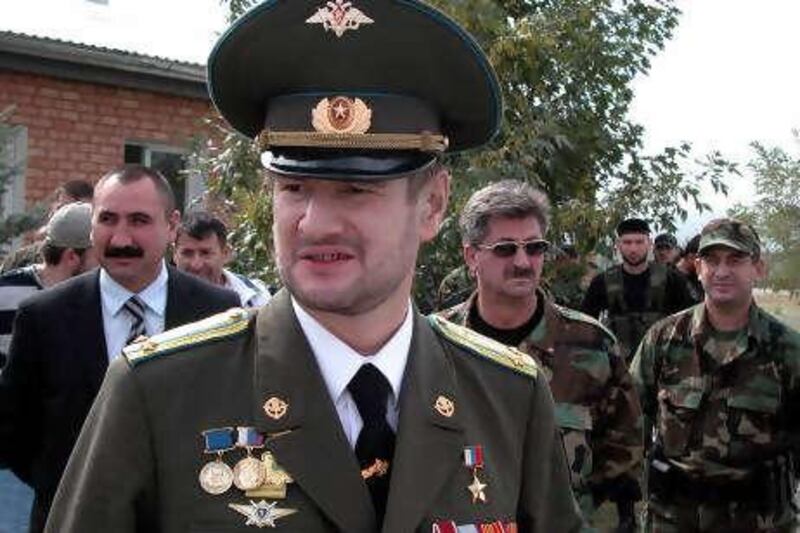 ** FILE ** In this Sept. 16, 2007 file photo, Sulim Yamadayev, center, seen at Hankala airport, a military base outside Grozny, Chechnya, southern Russia. Yamadayev  bitter foe of the Moscow-backed leader of Chechnya has been shot and badly wounded in Dubai, Russian news reports said Monday.  The newspaper Moskovsky Komsomolets said Sulim Yamadayev was attacked Saturday by an unidentified gunman near a luxury residential complex in Dubai where he lived. It quoted Yamadayev's brother as saying he was hospitalized with three gunshot wounds.(AP Photo) *** Local Caption ***  MOSB109_Russia_Dubai_Attack.jpg
