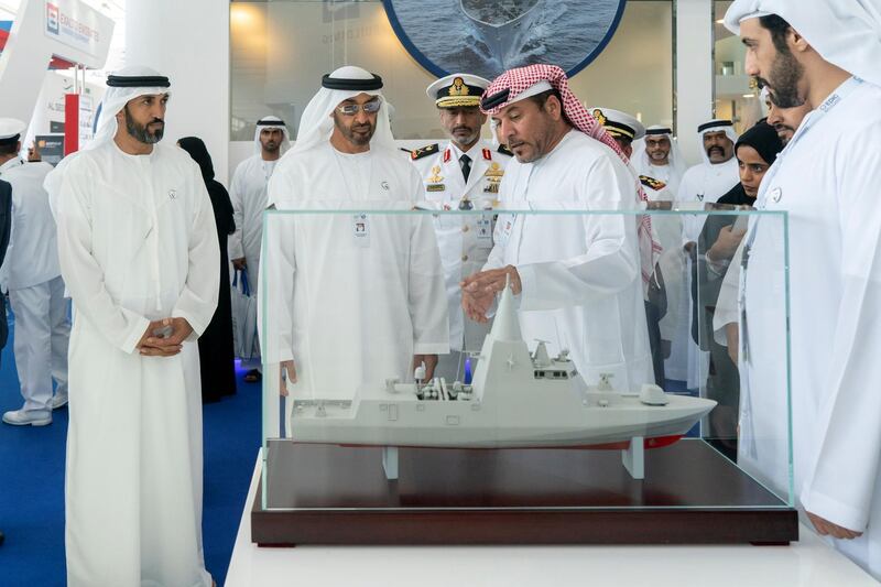 ABU DHABI, UNITED ARAB EMIRATES - February 20, 2019: HH Sheikh Mohamed bin Zayed Al Nahyan, Crown Prince of Abu Dhabi and Deputy Supreme Commander of the UAE Armed Forces (2nd L) visits Tasneef stand, during the 2019 International Defence Exhibition and Conference (IDEX), at Abu Dhabi National Exhibition Centre (ADNEC). Seen with Rear Admiral Pilot HH Sheikh Saeed bin Hamdan bin Mohamed Al Nahyan, Commander of the UAE Naval Forces (back C) and HE Mohamed Mubarak Al Mazrouei, Undersecretary of the Crown Prince Court of Abu Dhabi (L).

( Rashed Al Mansoori / Ministry of Presidential Affairs )
---