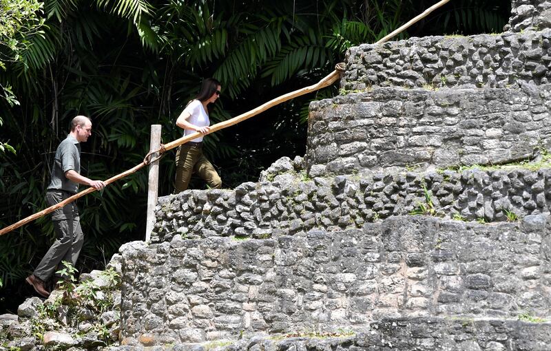 The couple were casually dressed as they climbed the steep steps of the pyramid-like structure called Caana. Reuters