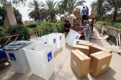 FILE PHOTO: Iraqi Independent High Electoral Commission staff members distribute ballot boxes and polling materials to polling stations in Basra, Iraq May 6, 2018.  REUTERS/Essam al-Sudani \File Photo