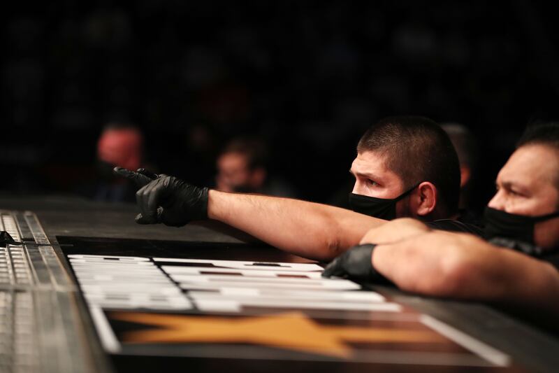 Khabib Nurmagomedov watches the flyweight bout between Allan Nascimento and Tagir Ulanbekov at the Etihad Arena.