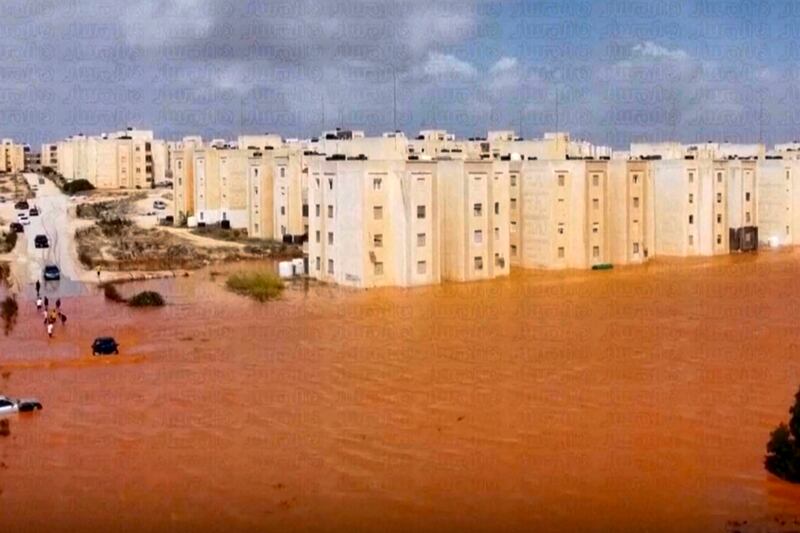 A residential street flooded in Marj. AP