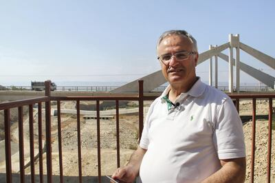 Najib Abou Karaki stands in front of the Mujib Bridge. In the 1950s the water level of the Dead Sea was at the same level as the bridge. Sophie Tremblay for The National