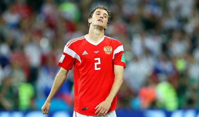 Russia's Mario Fernandes reacts after missing a penalty during the penalty shootout. Friedmann Vogel/EPA