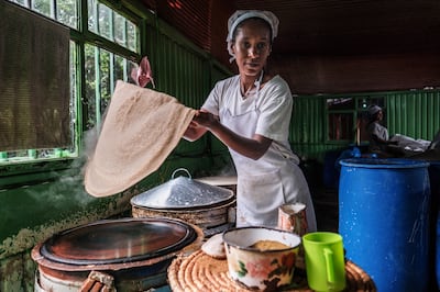 A woman prepares injera, a sour fermented flatbread with a slightly spongy texture, which is a staple Ethiopian food. AFP