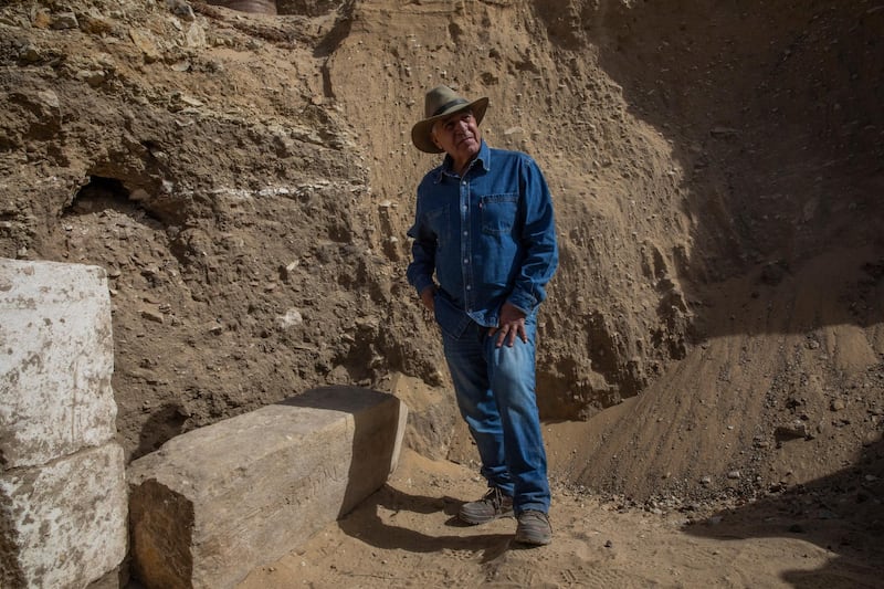 Egyptian archaeologist Zahi Hawass stands at the excavation site of the funerary temple of Queen Nearit, the wife of King Teti, where he and his team unearthed a vast necropolis filled with burial shafts, coffins and mummies dating back to the New Kingdom 3000 BC in Saqqara, south of Cairo, Egypt. AP