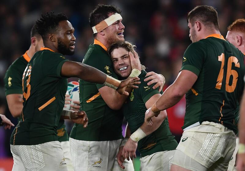 TOPSHOT - South Africa's players celebrate winning the Japan 2019 Rugby World Cup semi-final match between Wales and South Africa at the International Stadium Yokohama in Yokohama on October 27, 2019. / AFP / CHARLY TRIBALLEAU
