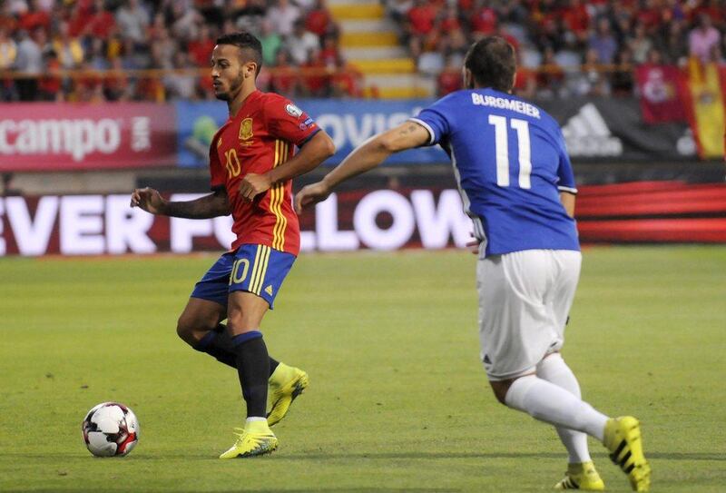 Thiago Alcantara controls the ball next to Liechtenstein midfielder Franz Burgmeier. JL Cereijido / EPA