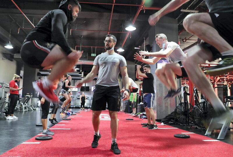 DUBAI, UNITED ARAB EMIRATES , August 10 – 2020 :- Participants during the daily ultimate training session at the UFC Gym in Murjan 6 in Jumeirah Beach Residence in Dubai. They are taking part in the 90 minutes MMA Mash up. (Pawan Singh / The National) For News/Online/Instagram. Story by Nick Webster