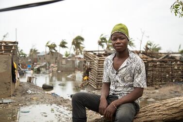 A young man sits in front of destroyed settlements in Praia Nova, Beira, Mozambique, after the Tropical Cyclone Idai destroyed and damaged homes and knocked out electricity and communications on 15 March 2019. EPA/IFRC