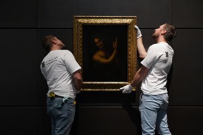 'John The Baptist' by Leonardo Da Vinci being delivered and hung at The Louvre Abu Dhabi. Mahmoud Rida / The National