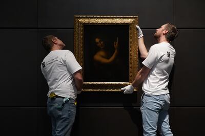 'John The Baptist' by Leonardo Da Vinci being delivered and hung at The Louvre Abu Dhabi. Mahmoud Rida / The National