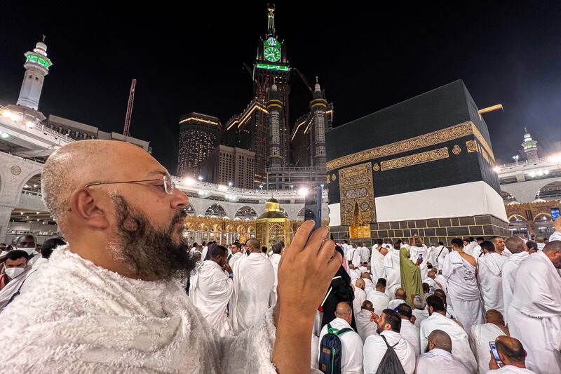 A worshipper uses his phone to film the crowd of pilgrims around the Kaaba at the Grand Mosque. AFP