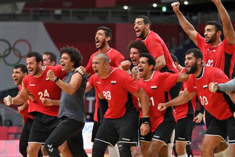 Egypt's players celebrate their victory after the men's quarterfinal handball match against Germany. AFP